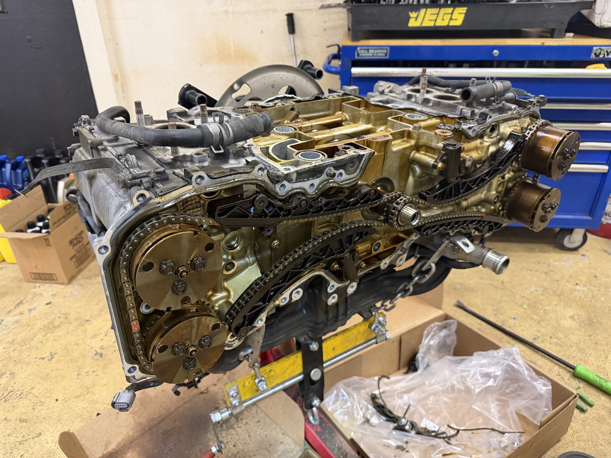 A Subaru engine opened up on a stand at Springs Auto Repair