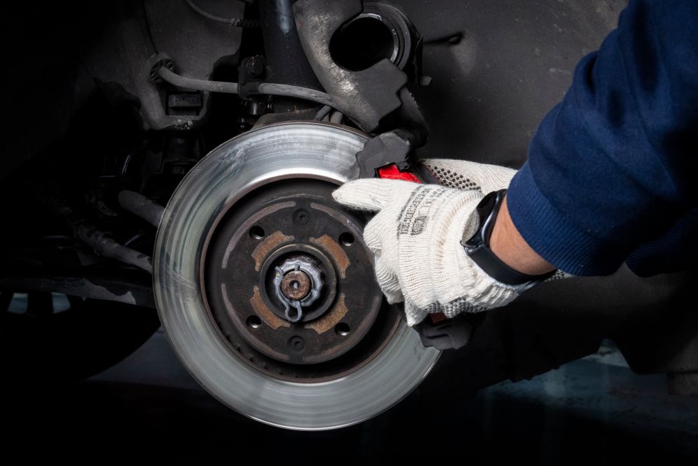 Mechanic working on a car's brake system
